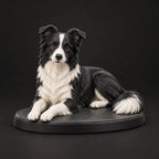 Border Collie figurine in lying relaxed pose, studio view