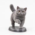 British Shorthair figurine in playful run pose on a clean background