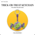 Illustration: the trick-or-treat candy keychain hanging from its cord in front of a yellow circle