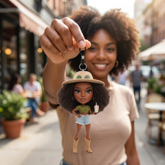 Illustration: a person holding up their boho crochet fashion doll keychain by its cord