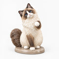 Ragdoll Cat figurine in paw up pose on a clean background