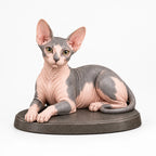 Sphynx Cat figurine in lying relaxed pose on a clean background