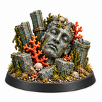 Sunken shrine terrain miniature with a stone face, coral, and broken pillars.